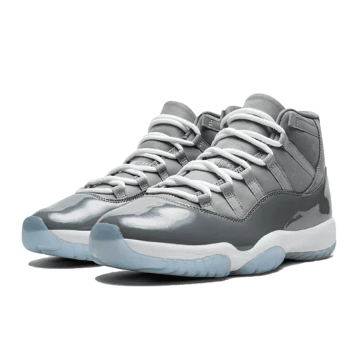 Jordan 11 Retro Cool Grey (2021), Air Jordan 11 Cool Grey, grey and white Jordans, stylish high tops, Nike Air Jordan, classic basketball shoes, limited edition Jordans, sneaker collection, urban fashion sneakers, Cool Grey colorway, retro sneaker design, Jordan brand shoes, premium materials, iconic Jordans, comfortable high tops, streetwear style, collector's edition Jordans, shiny patent leather, timeless footwear.