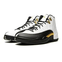 Jordan 12 Retro Royalty Taxi, Air Jordan 12 Royalty, black and white Jordans, stylish high tops, Nike Air Jordan, classic basketball shoes, limited edition Jordans, sneaker collection, urban fashion sneakers, royalty colorway, retro sneaker design, Jordan brand shoes, premium materials, iconic Jordans, comfortable high tops, streetwear style, collector's edition Jordans, luxury-inspired footwear.